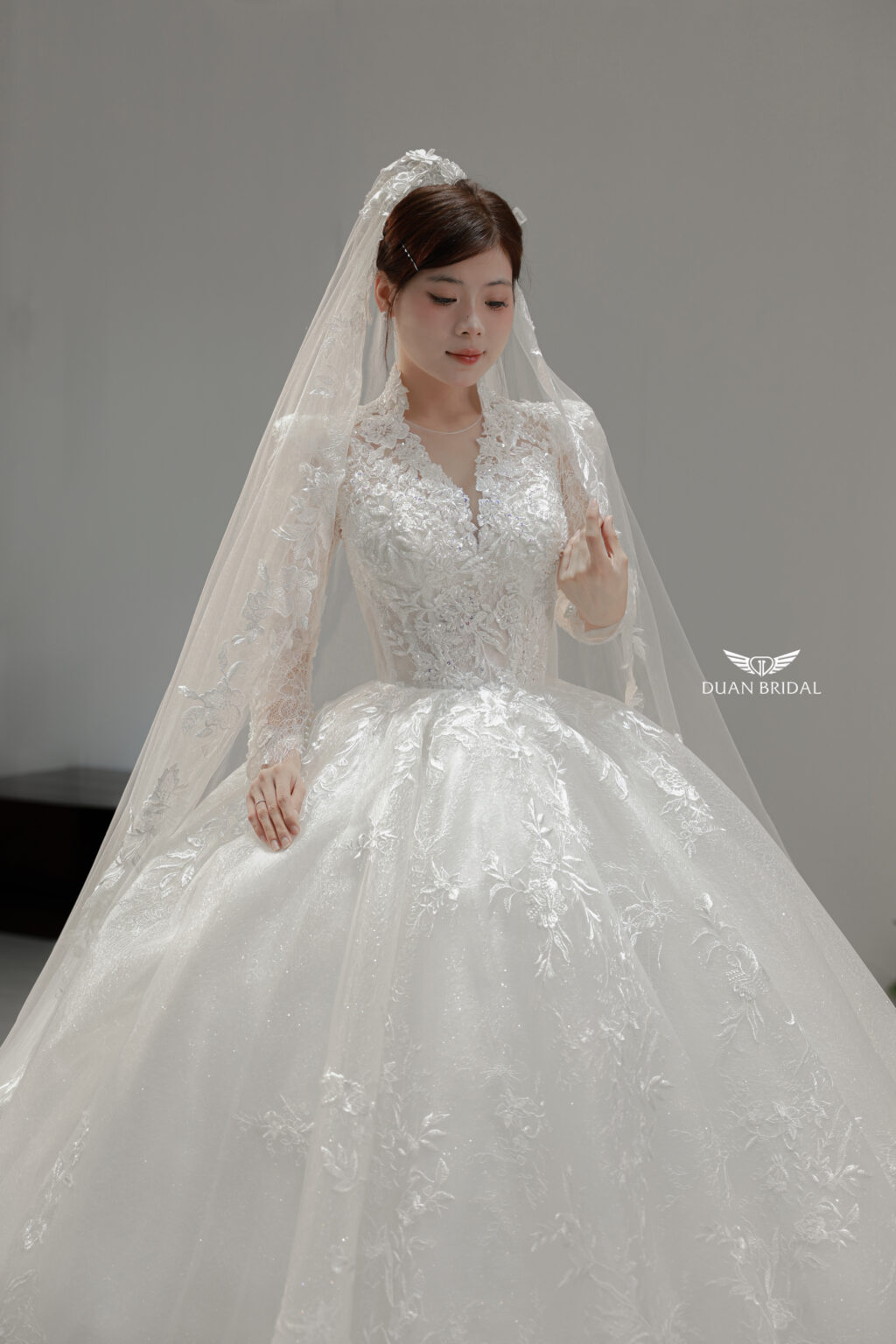 Vienna Glow - Long sleeve floral lace ball gown wedding dress